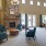 clubhouse with a fireplace and chairs