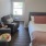 bedroom with sitting area next to window