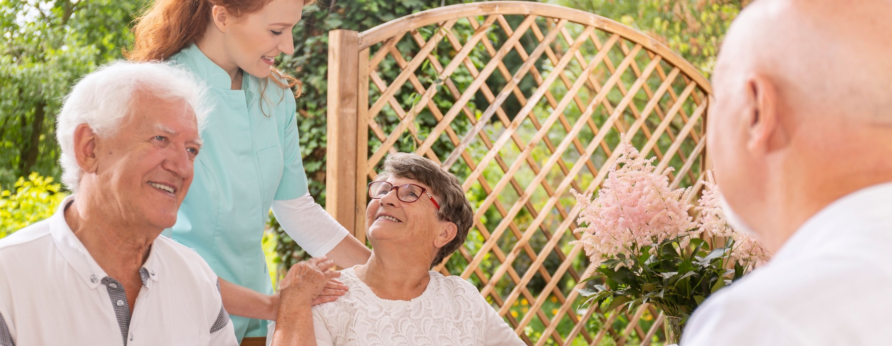 Residents and caregiver gathered together