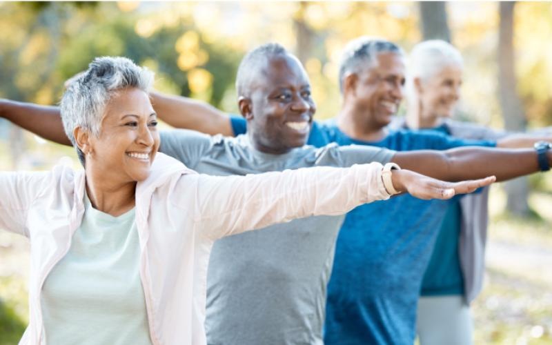 a group of people stretching outside